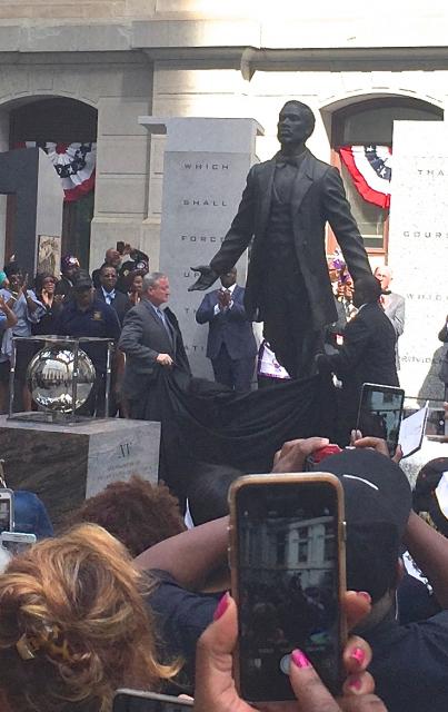 Philadelphia Mayor James Kenny (l) and sculptor Branly Cadet (r) unveil Octavius Catto statue. LBWPhoto